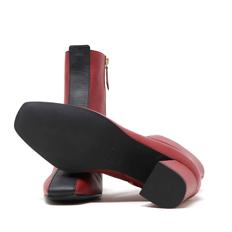 Sylven Jayne Scarlet/Black vegan apple leather boots - one shoe showing bottom sole